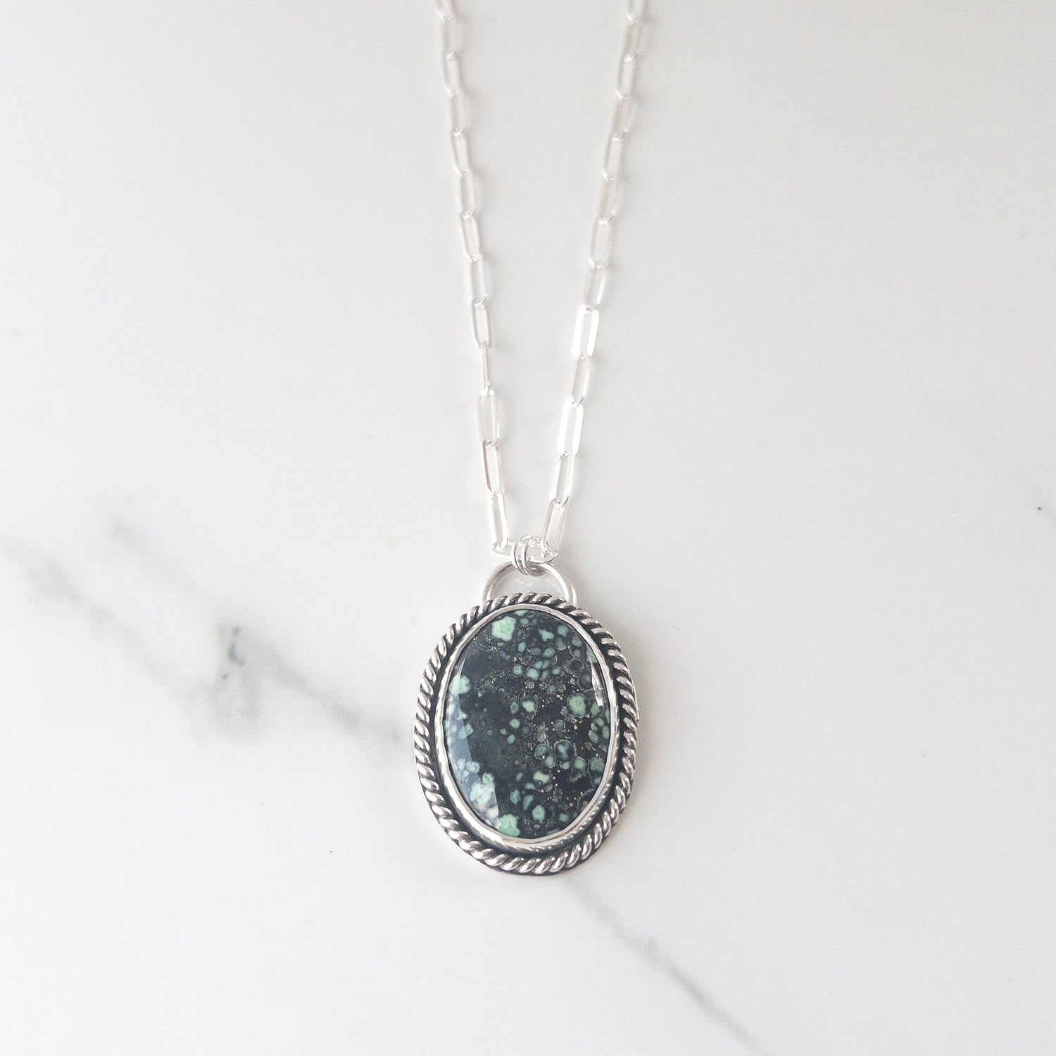Black and blue/green New Lander Variscite in sterling silver necklace on white background, representing the Petrus Collection by Sagely Sparrow