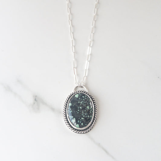 Sterling silver statement necklace with New Lander variscite gemstone pendant, featuring hidden crucifix cutout on back, on paperclip chain – handcrafted Catholic jewelry.