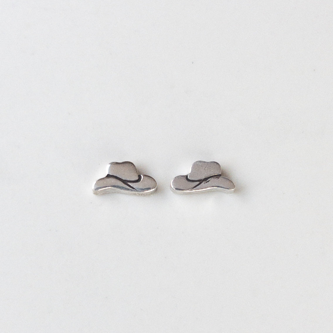 Sterling silver cowboy hat stud earrings displayed on neutral background – Western faith-inspired jewelry for women.