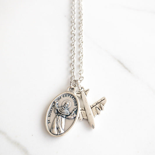 Catholic necklace featuring a silver-tone Saint Joseph of Cupertino medal with a small star charm, symbolizing his patronage of students and test takers. Handmade and gift-ready, perfect for exams, graduations, or Confirmation.