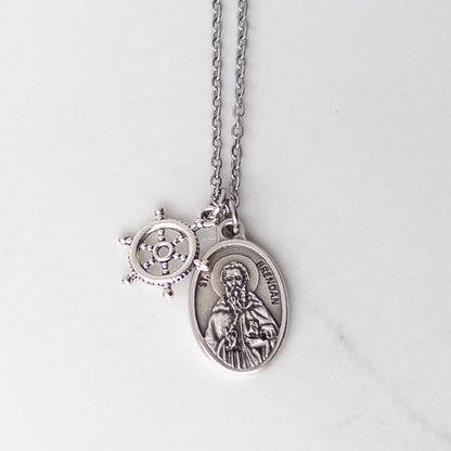 St. Brendan saint medal necklace with a ship's wheel charm on a stainless steel chain