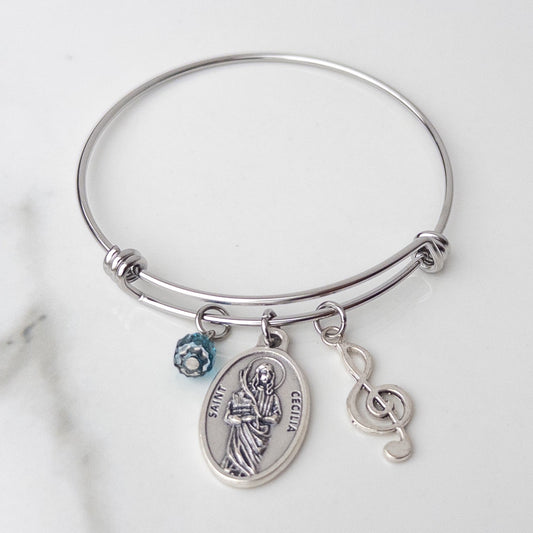 St. Cecilia stainless steel bracelet with Catholic saint medal, silvertone treble clef charm, and blue crystal bead for musicians and Confirmation gifts