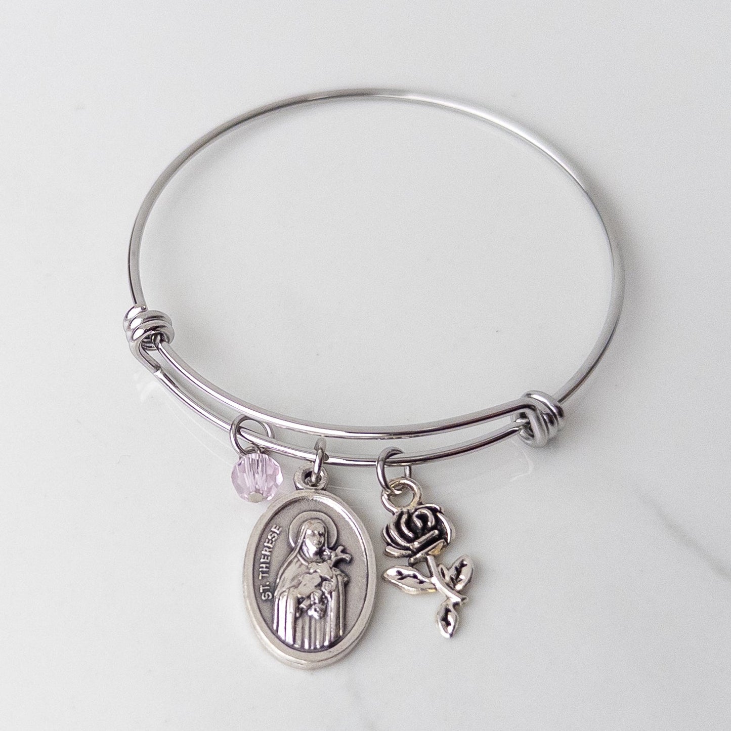 St. Therese of Lisieux stainless steel bracelet for girls, Catholic Confirmation gift with saint medal charm, silver rose charm and pink bead on bangle