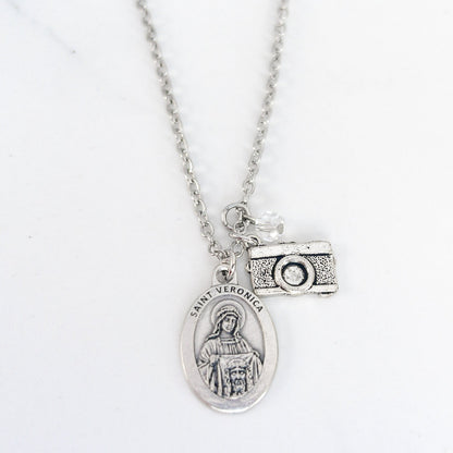 Saint Veronica necklace with silver medal and camera charm on stainless steel chain, Catholic patron saint of photographers jewelry