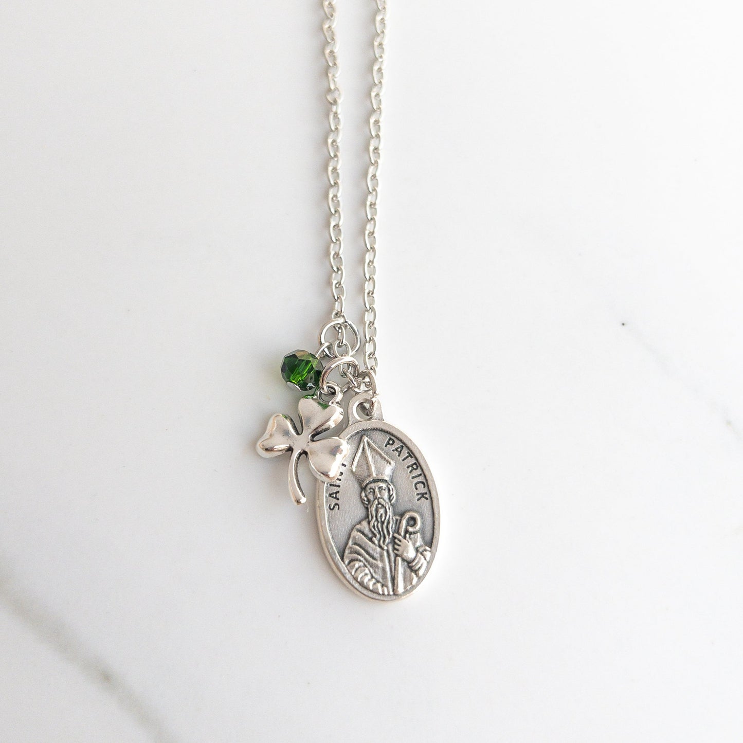 St. Patrick necklace with shamrock charm, Saint Patrick medal, and green glass bead on stainless steel chain